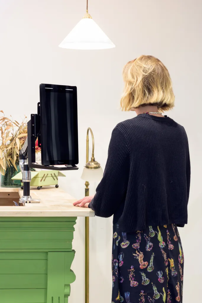 Woman using the LoopKiosk